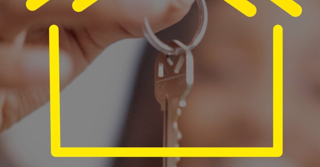 Close-up of hands holding house keys with yellow house icon overlay, representing real estate.